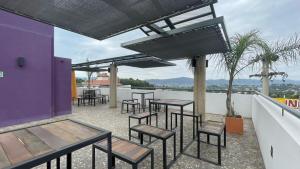 a group of tables and chairs on a patio at Círculos del Lago in Villa Carlos Paz