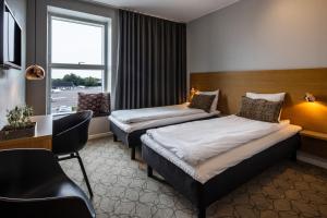 Ένα ή περισσότερα κρεβάτια σε δωμάτιο στο Aalborg Airport Hotel