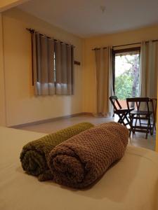 a bedroom with a pillow on a bed at casaOCA in Lençóis