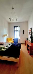 a bedroom with a large bed in a room at City center apartment in Sopron