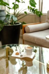 a cup of coffee and a cookie on a table at Holiday Inn Hotel Port of Miami-Downtown, an IHG Hotel in Miami