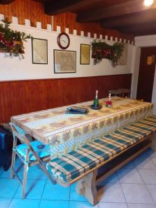 a wooden table in a room with a tableablish at Matanovi dvori in Bribir