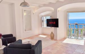 a living room with a view of the ocean at Porta Nova Suites Altea - Adults Only in Altea