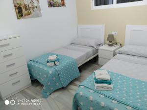 Łóżko lub łóżka w pokoju w obiekcie Delfin Home