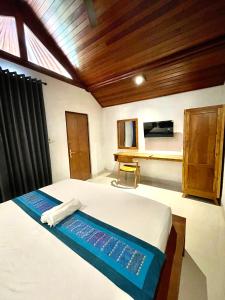 Postel nebo postele na pokoji v ubytování DIMUWA Ubud