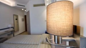 Postel nebo postele na pokoji v ubytování Hotel La Serena