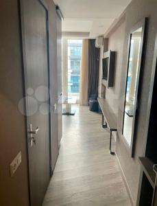 a hallway of a hotel room with a door at GOOD-VIBES Apartments in Batumi