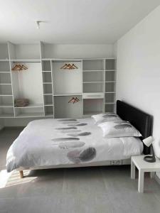 Posteľ alebo postele v izbe v ubytovaní Maison quetigny