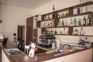 a bar with a lot of bottles on the wall at Penzión Tavel in Prešov