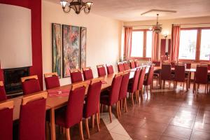 a conference room with a long table and chairs at Tavel boutique hotel in Prešov