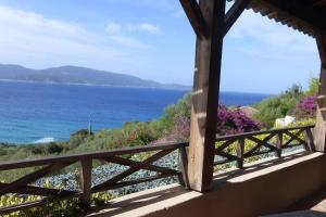 a view of the ocean from a house at Villas Valinco San Martinu Corse du Sud - vue et proche mer - piscines-7 chambres in Olmeto