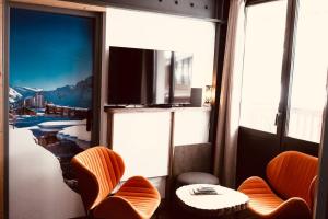TV a/nebo společenská místnost v ubytování Val Claret, Tignes Appt cosy 5-6pers Location dimanche dimanche en saison