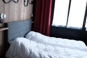Postel nebo postele na pokoji v ubytování Val Claret, Tignes Appt cosy 5-6pers Location dimanche dimanche en saison
