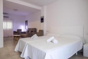 Postel nebo postele na pokoji v ubytování Sal Mar Suites