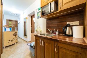 A kitchen or kitchenette at Penzión Zunama