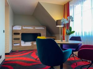 Ένα ή περισσότερα κρεβάτια σε δωμάτιο στο HKK Hotel Wernigerode