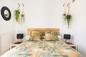 a bedroom with a bed and two night stands at LUNAROOM Center & Quiet Guesthouse in Málaga
