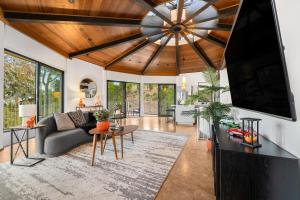 a living room with a large flat screen tv at Via Vallarta in Los Angeles