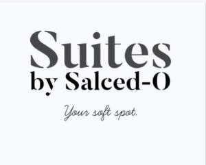 a sign that reads smiles by saled o at Suites By SalcedO in Santo Domingo