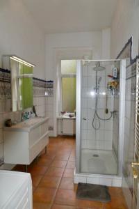 a bathroom with a shower and a sink at Private Rooms in Hannover
