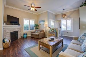 a living room with a couch and a fireplace at Las Vegas Condo Rental with Pool Access! in Las Vegas