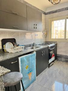 a kitchen with a sink and a counter top at Chalet in La Jolie Marina El Ain El Sokhna - Egyptian Families Only in Ain Sokhna +37 photos