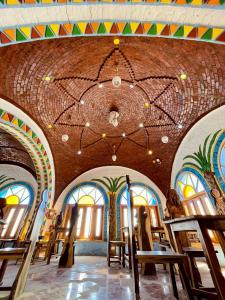 a large building with a ceiling with a chandelier at Kato Dool Wellness Resort in Aswan