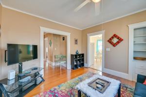 a living room with a large flat screen tv at Revere Vacation Rental Near MBTA about 7 Mi to Boston! in Revere