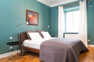 Posteľ alebo postele v izbe v ubytovaní Apartments Rynek Glowny