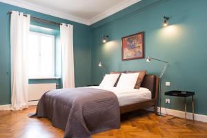 Posteľ alebo postele v izbe v ubytovaní Apartments Rynek Glowny