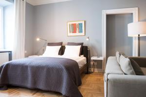 Posteľ alebo postele v izbe v ubytovaní Apartments Rynek Glowny