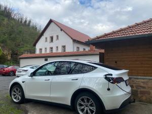 a white car parked in front of a house at Felsenmühle Neuleiningen in Neuleiningen