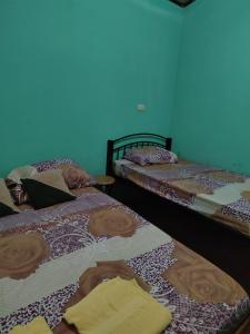 Cama o camas de una habitación en Ramaye Beach House
