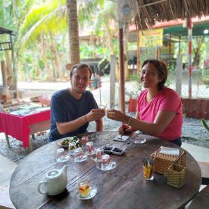 a man and a woman sitting at a table at BenTrestay in Giồng Tú Ðiền