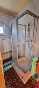 a shower with a glass door in a bathroom at Wasserskianlage Eilenburg in Eilenburg