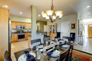 a kitchen and dining room with a table and chairs at Cozy Arizona Retreat with Fireplace, Patio and Grill! in Flagstaff