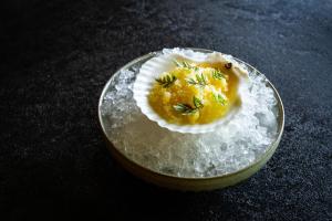 a deviled egg in a bowl of snow at Auberge Saint-Mathieu in Saint Mathieu Du Parc