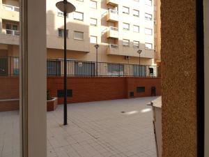 a view from a window of a courtyard with buildings at PISO CON VISTAS in Burjasot