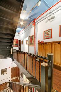 a stairway in a building with a black railing at Chelsea Pines Inn in New York