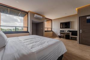 Postel nebo postele na pokoji v ubytování Hotel Kavia Premium - Paseo Montejo