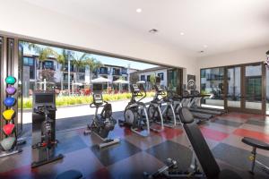 a gym with a row of treadmills and ellipticals at Sunnyvale studio w pool ac wd nr freeways SFO-1142 in Sunnyvale