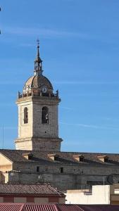 a building with a clock tower on top of it at ACENI in Ciudad Real