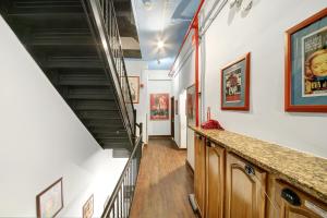 a hallway with stairs leading to a stair case at Chelsea Pines Inn in New York