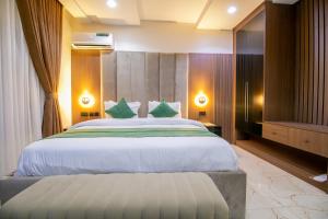Letto o letti in una camera di Tranquila Hotels and Suites Abuja