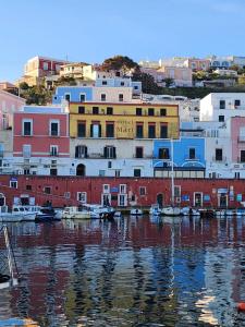 a group of buildings sitting next to a body of water at Luci del Mari in Ponza