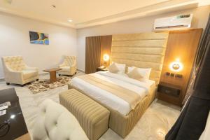 Letto o letti in una camera di Tranquila Hotels and Suites Abuja