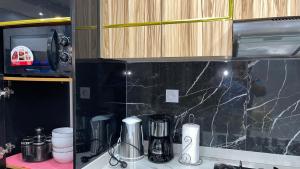 Kuchyň nebo kuchyňský kout v ubytování Suna' a Home Bonapriso