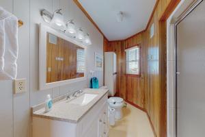 a bathroom with a sink and a toilet at Stellar Vista in Avon +32 photos
