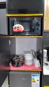 Kuchyň nebo kuchyňský kout v ubytování Suna' a Home Bonapriso