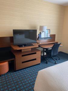 a hotel room with a desk with a television and a deskictericter at Fairfield Inn & Suites by Marriott Durango in Durango